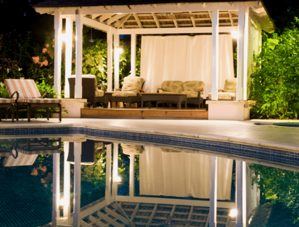 Pool at night with gazebo in background