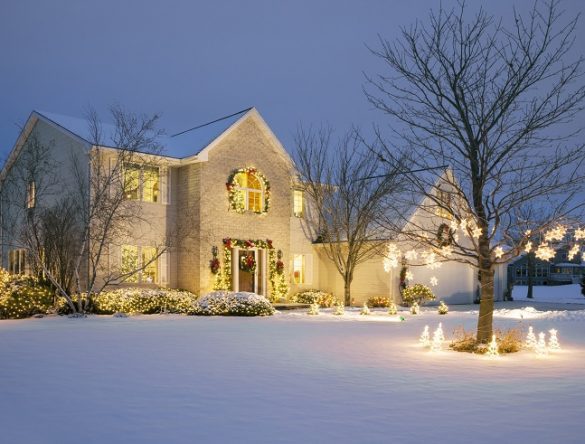 House decorated for Christmas with snow outside